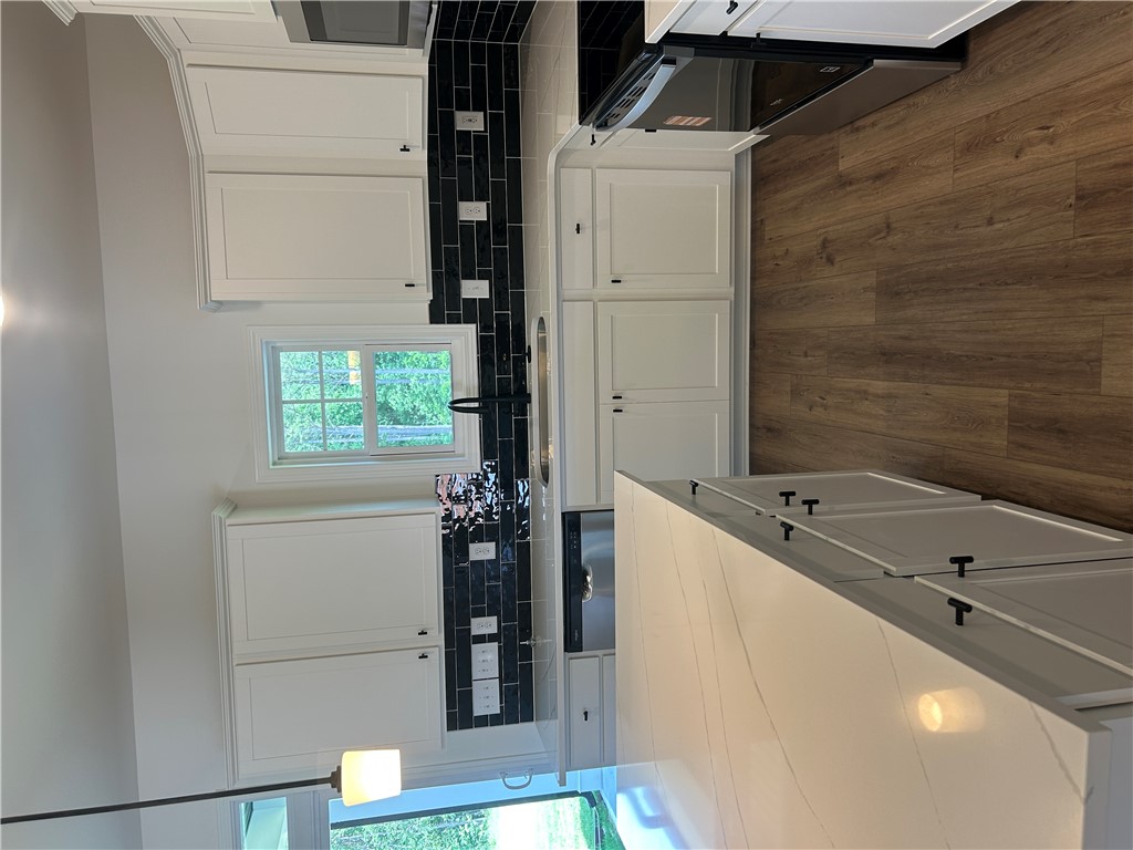 202 Bellflower Lane Pendleton, SC 29670 - Photo 9 of 27 A well-appointed kitchen features a large island and ample cabinetry, offering a seamless blend of style and functionality.