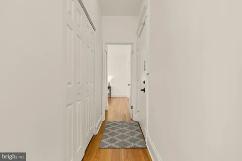 a view of a bathroom from a hallway