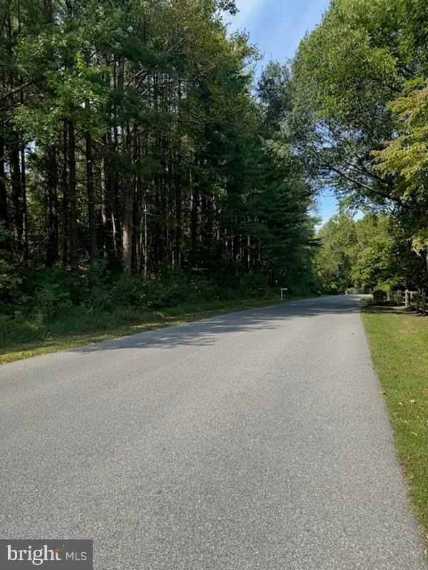 2550 Redbud Lane Owings, MD 20736 - Photo 2 of 10 a view of a field with trees in front of it