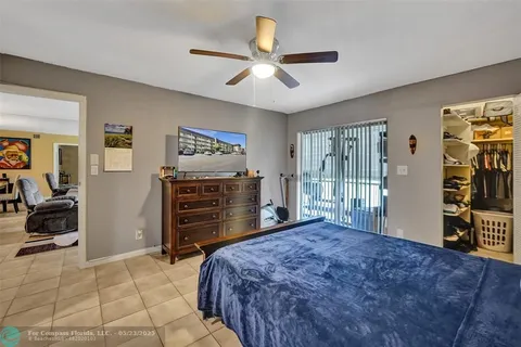 a bedroom with a bed and a television