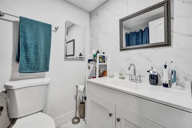 a bathroom with a bathtub and shower