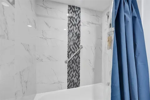 a bedroom with a bed and a tv