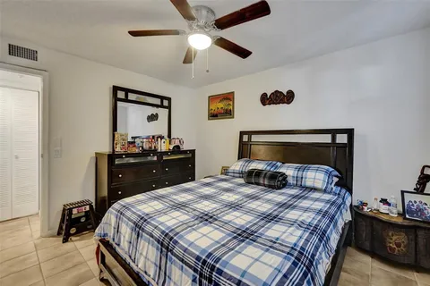 a bedroom with a bed and a dresser