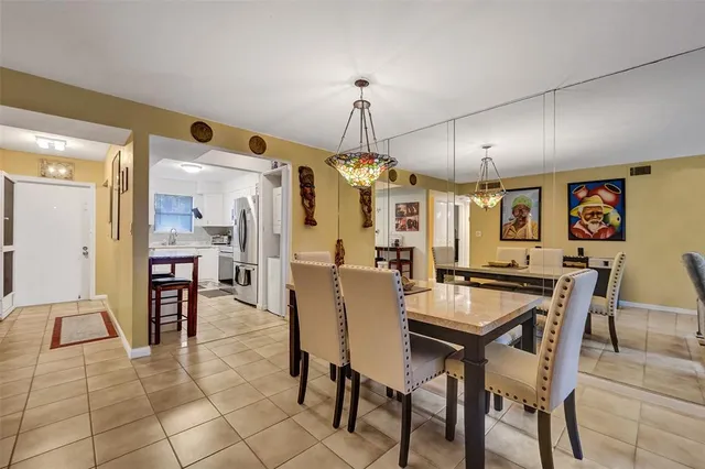 a dining room with furniture and window