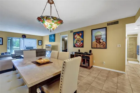 a living room with furniture wooden floor and a flat screen tv