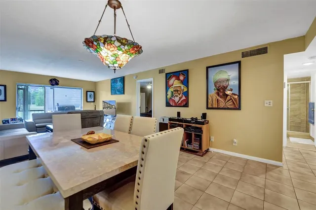 a living room with furniture wooden floor and a flat screen tv