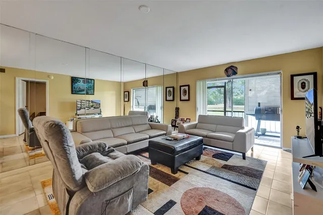 a porch with a table and chairs