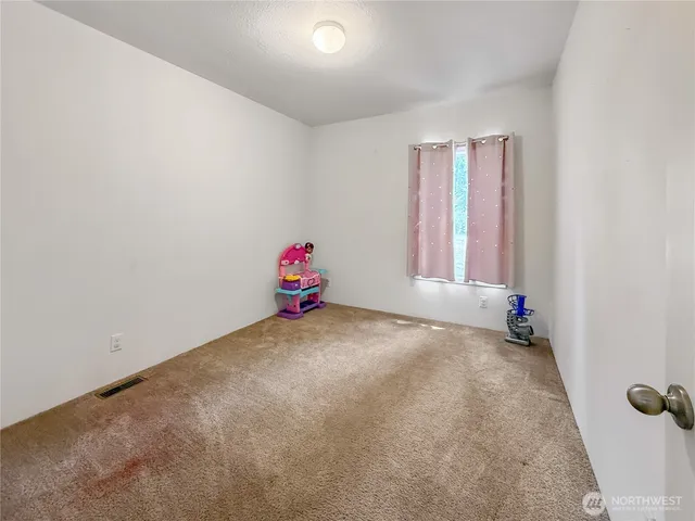 a view of a room with toys and a window