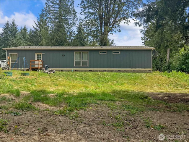 a backyard of a house with yard and garage