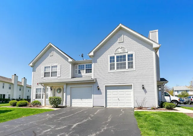 a view of a yard in front view of a house
