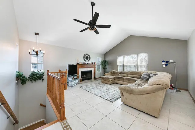 a living room with furniture and a fireplace