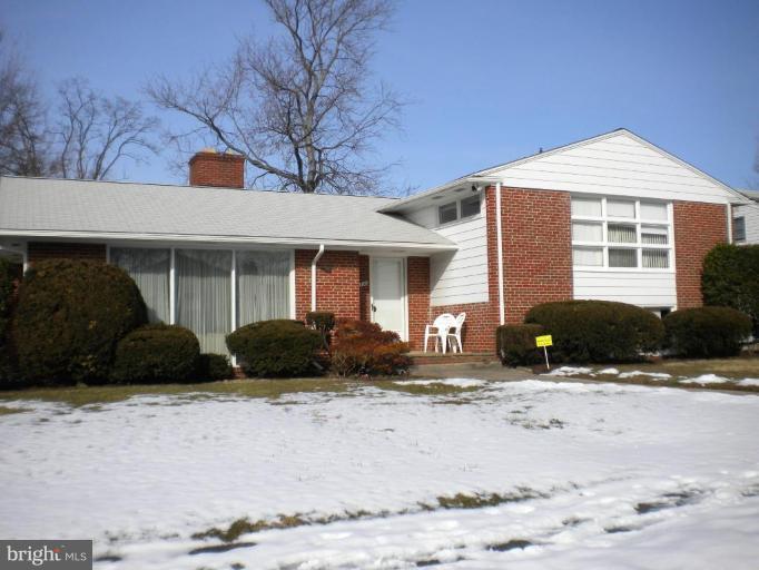 3206 Hatton Road Pikesville, MD 21208 - Photo 1 of 1 a front view of a house with a yard