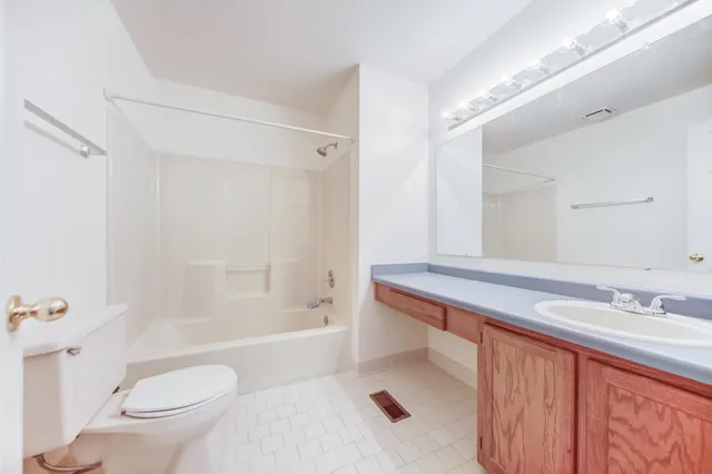 a bathroom with a sink a toilet and a bathtub