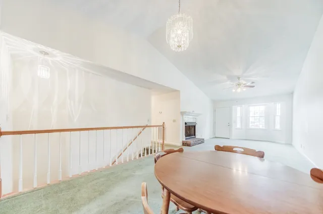 a view of a livingroom with furniture window and wooden floor