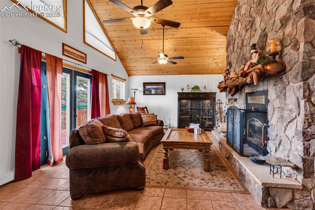 209 Rosewood Road Westcliffe, CO 81252 - Photo 19 of 49 Custom live edge fireplace mantel and wood burning fireplace