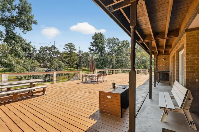 a view of a terrace with wooden floor and outdoor seating