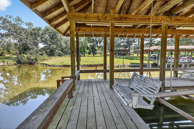 a view of a balcony with wooden floor