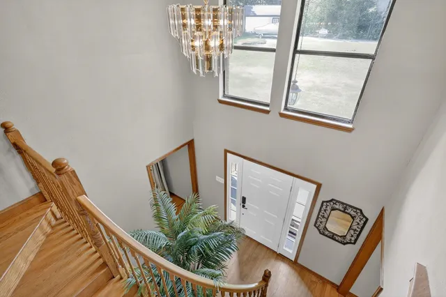 a view of a hallway with paintings on the wall