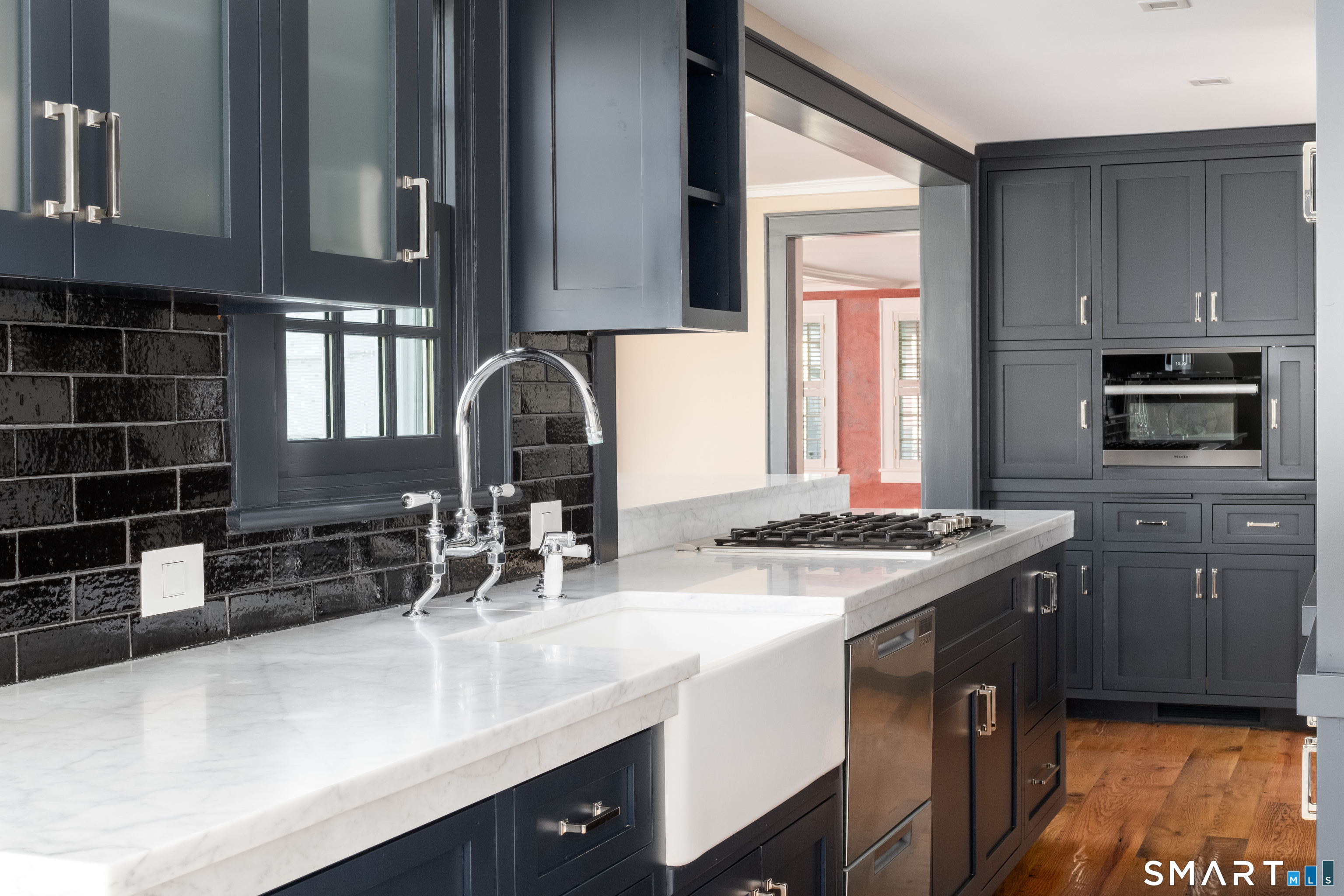 155 Long Ridge Road Danbury, CT 06810 - Photo 19 of 40 Long runs of cabinetry, premium appliances, and strong natural light give the room both utility and quiet architectural presence.