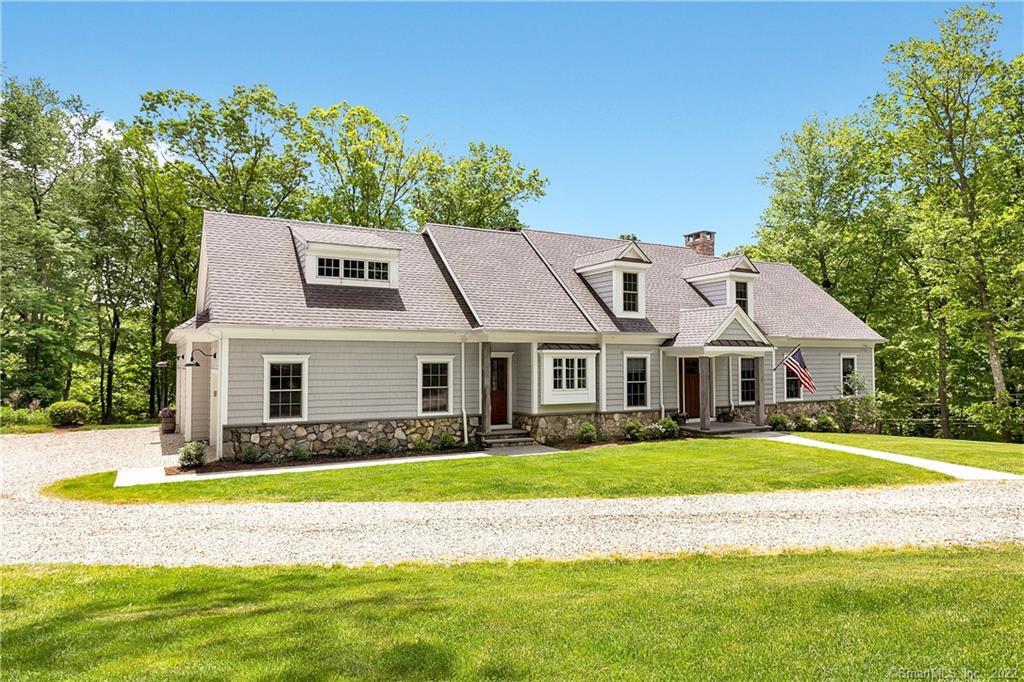 258 Wilton Road East Ridgefield, CT 06877 - Photo 1 of 1 a front view of a house with a yard