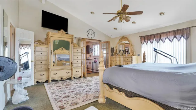 a bed room with a bed and a chair