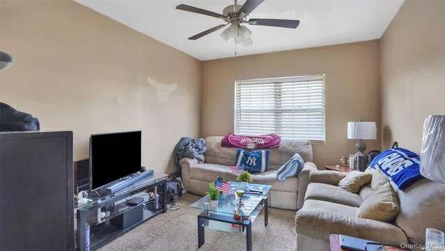 a white toilet sitting next to a bathroom sink and tub