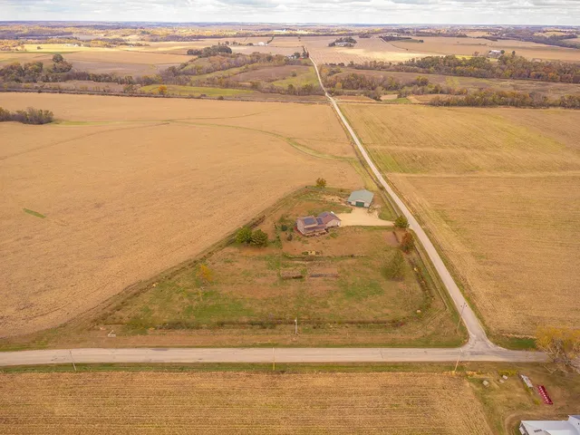 a kitchen with stainless steel appliances granite countertop a stove a sink dishwasher a refrigerator and wooden floor