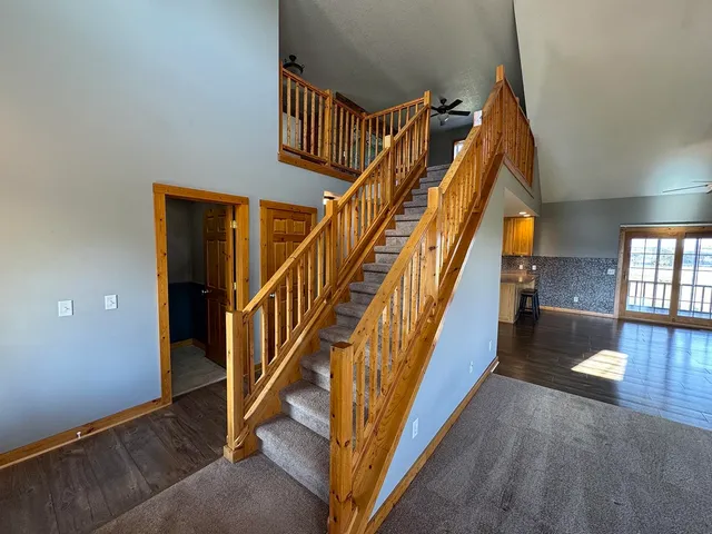 a view of a livingroom with furniture and a kitchen