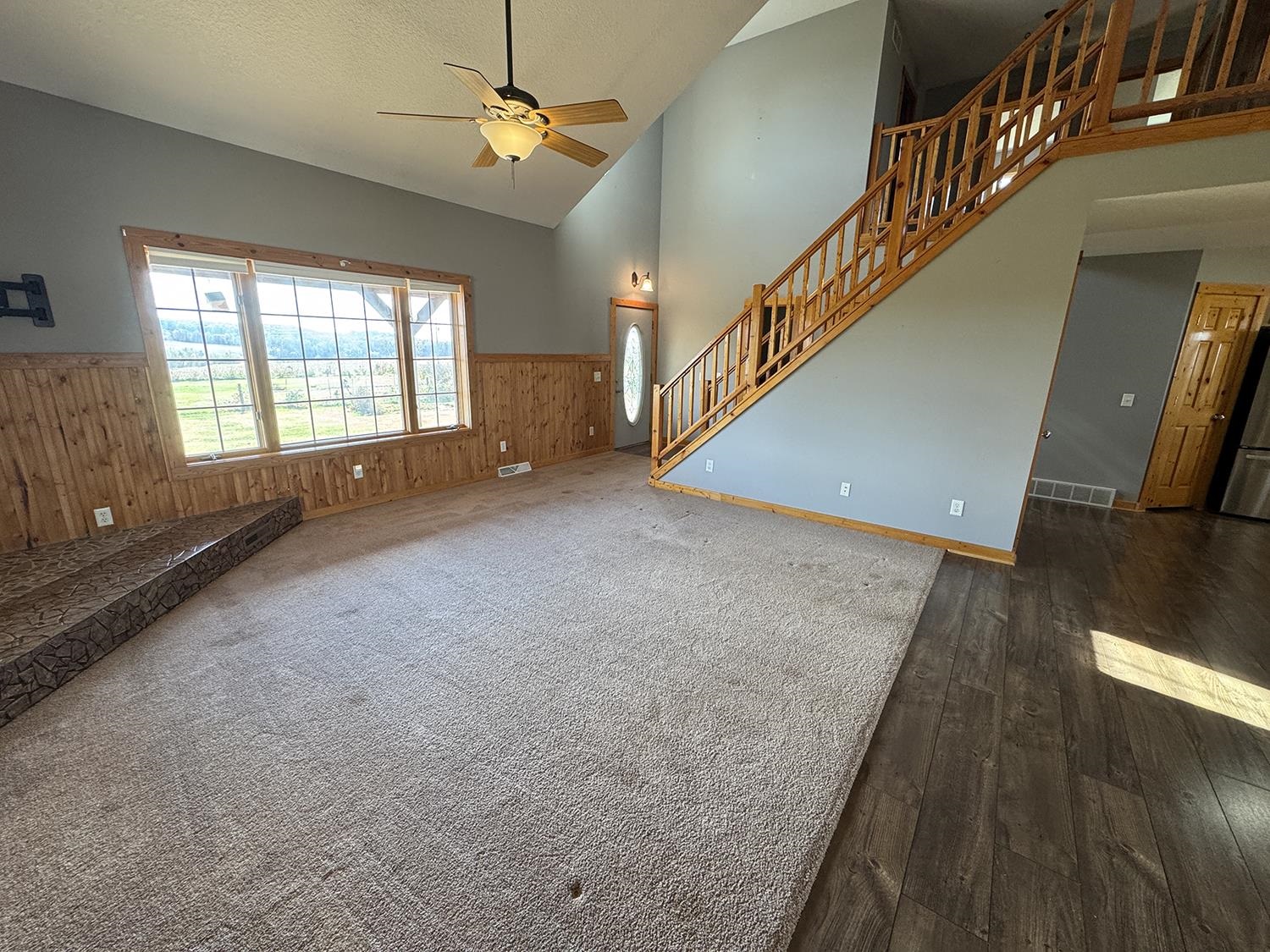 7876 Hickory Grove Road Savanna, IL 61074 - Photo 21 of 67 a view of an empty room with wooden floor and a window