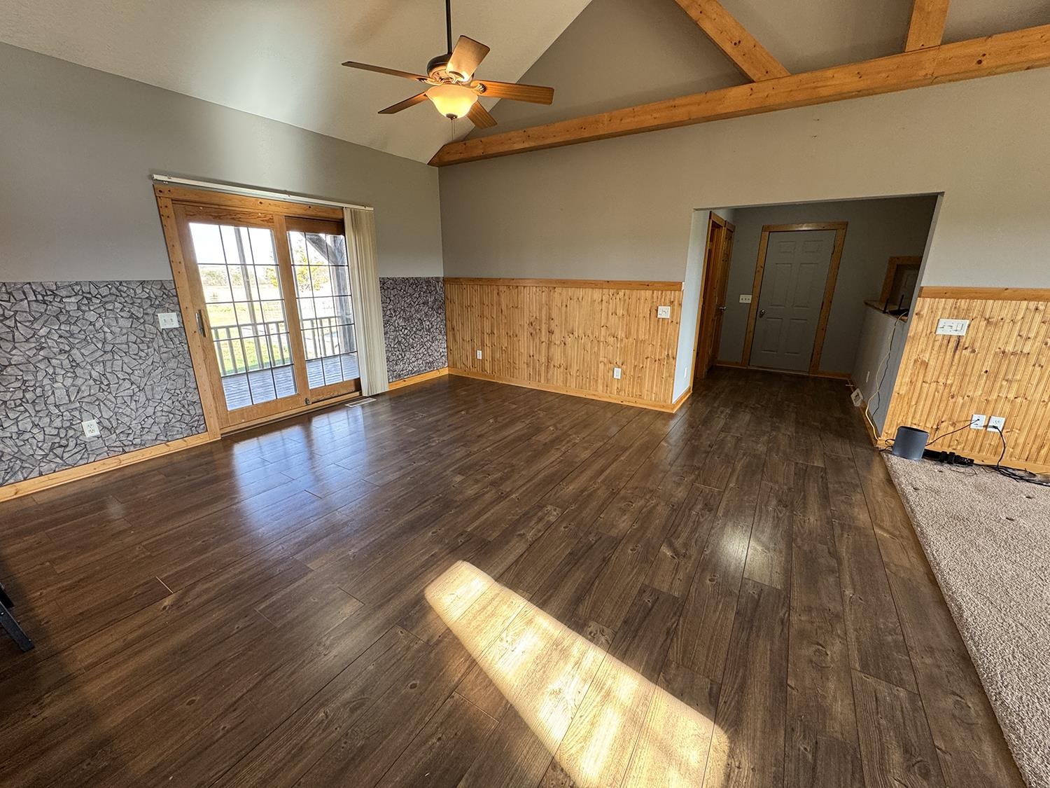 7876 Hickory Grove Road Savanna, IL 61074 - Photo 23 of 67 a view of an empty room with wooden floor and a window