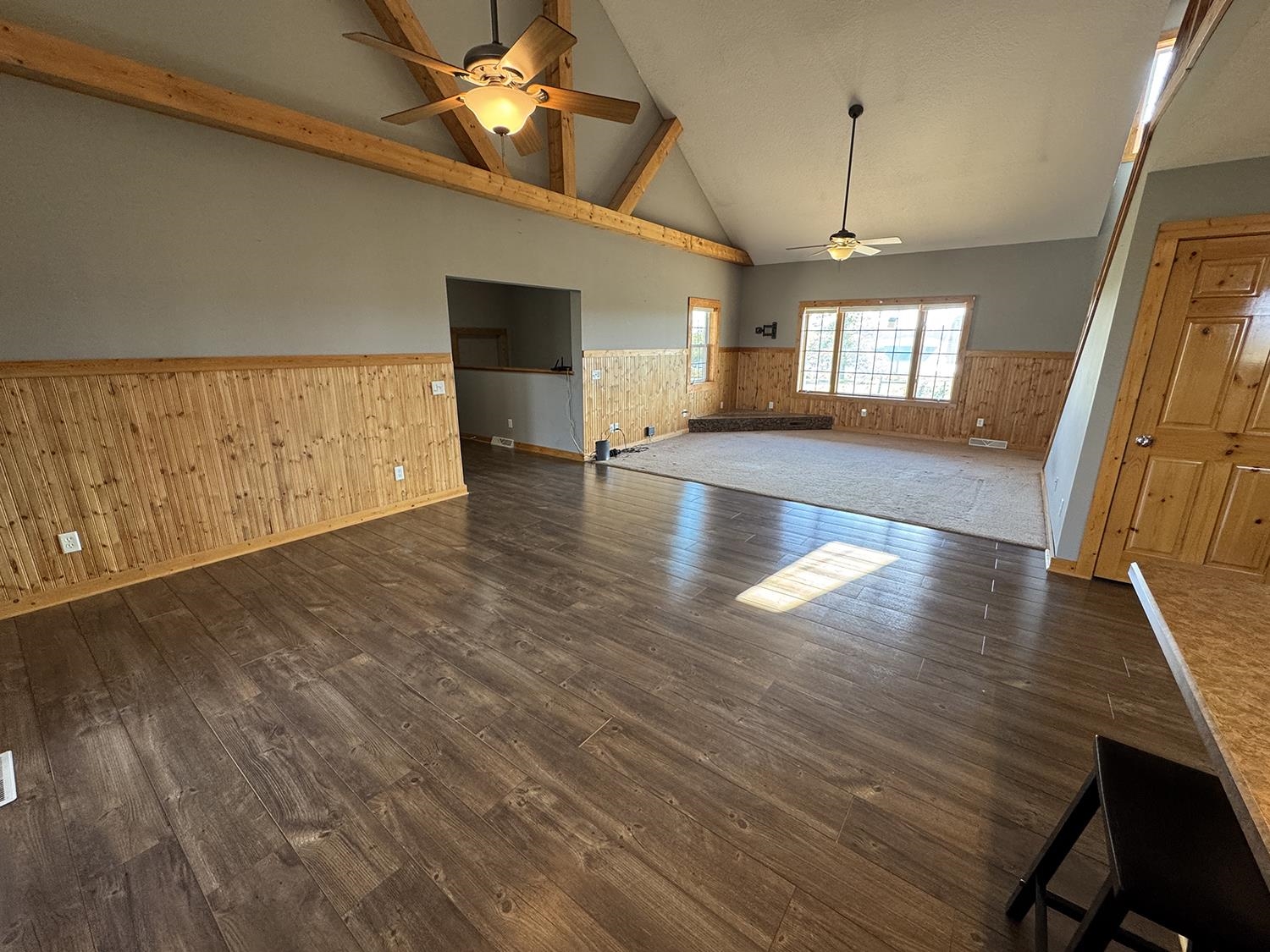 7876 Hickory Grove Road Savanna, IL 61074 - Photo 26 of 67 a view of a livingroom with wooden floor and a ceiling fan