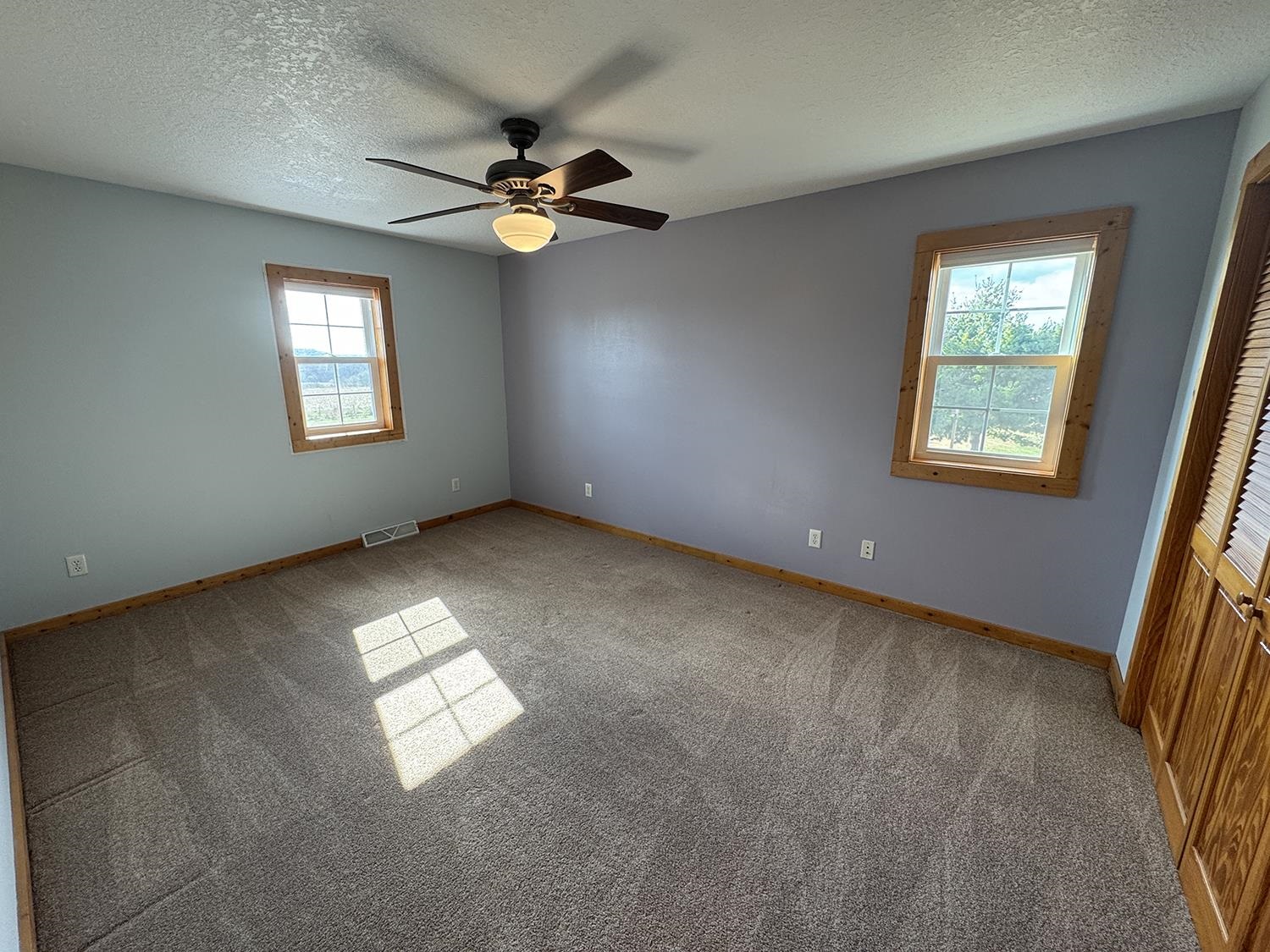 7876 Hickory Grove Road Savanna, IL 61074 - Photo 38 of 67 an empty room with windows and fan
