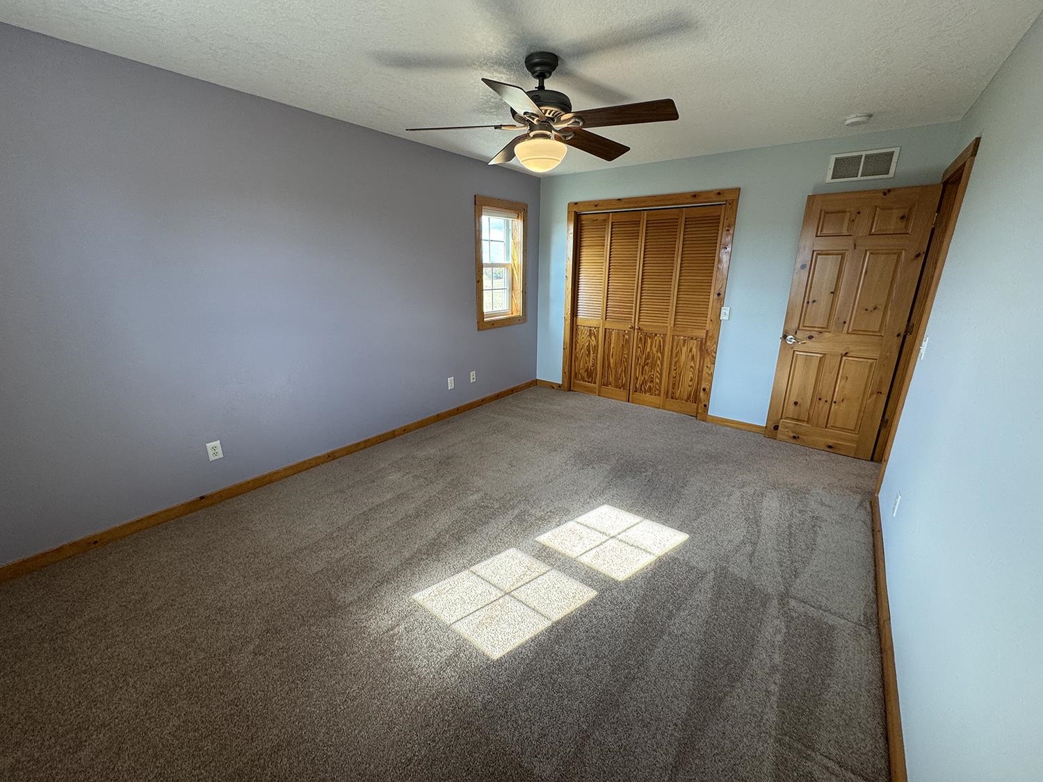 7876 Hickory Grove Road Savanna, IL 61074 - Photo 39 of 67 a view of a livingroom with a window and a ceiling fan