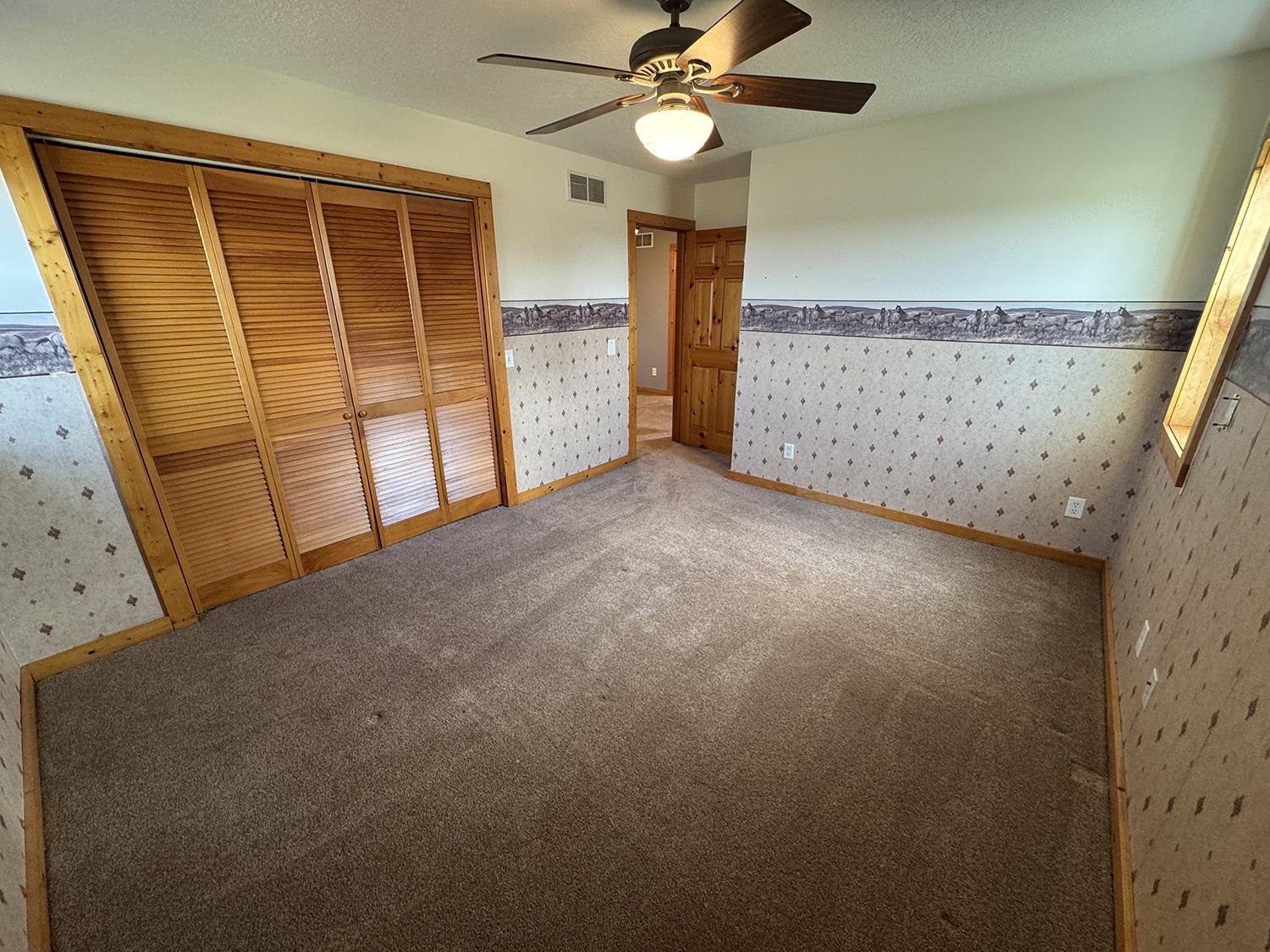 7876 Hickory Grove Road Savanna, IL 61074 - Photo 44 of 67 a view of an empty room with a window