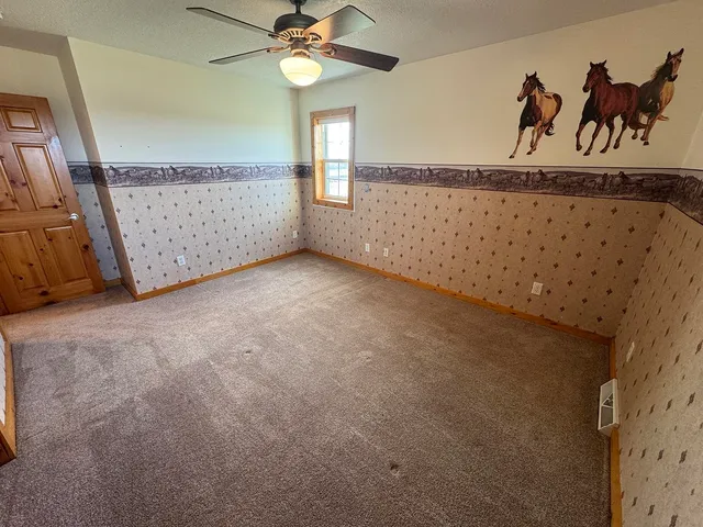 a view of livingroom with furniture and toys