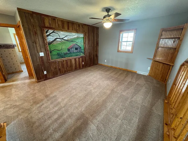 a view of an empty room with a garage