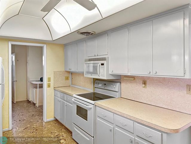 a view of an empty room with glass door