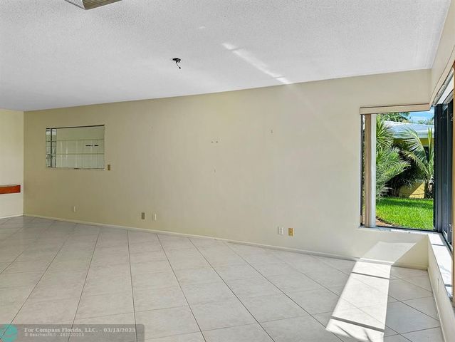 a kitchen with a sink and a window