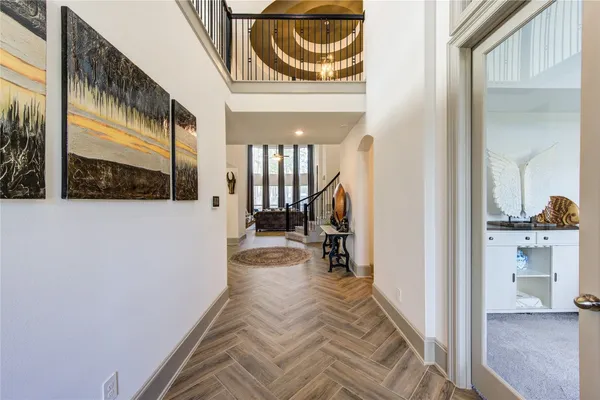 a view of a hallway with a dining area