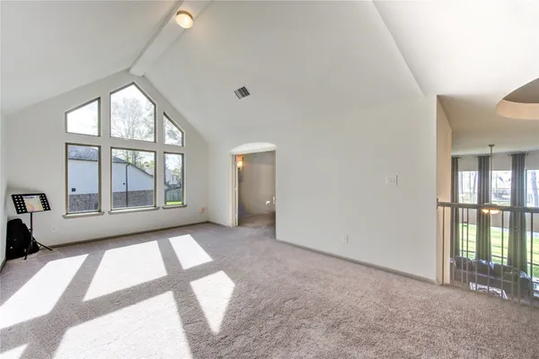 a view of hallway with windows