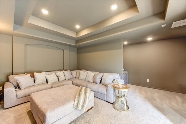 a living room with furniture and white walls