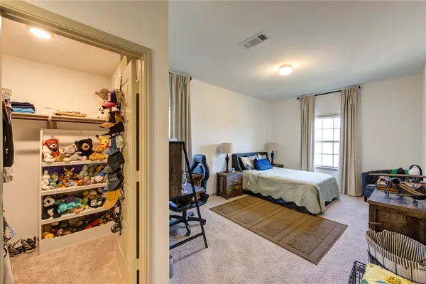 a living room with furniture gym equipment and a window