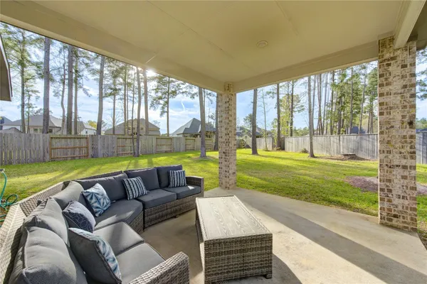 a living room with furniture and a garden