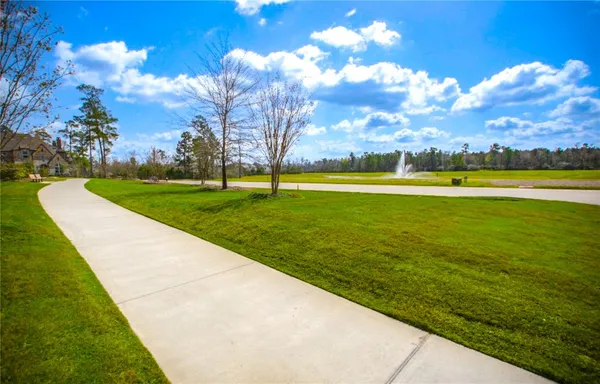 a view of a golf course with a lake