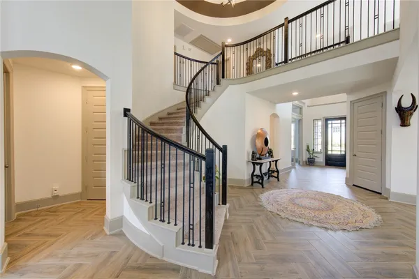 a view of a hallway with a livingroom and entryway