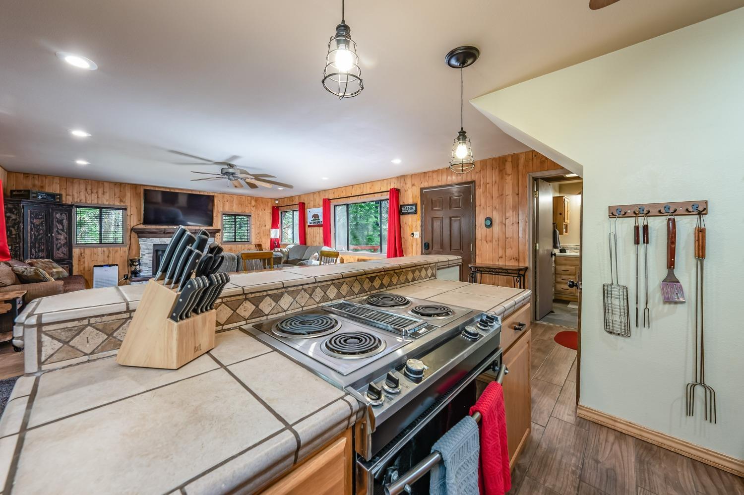 41534 Indian Rock Road Shaver Lake, CA 93664 - Photo 12 of 19 a view of a kitchen with stainless steel appliances granite countertop a stove and a refrigerator