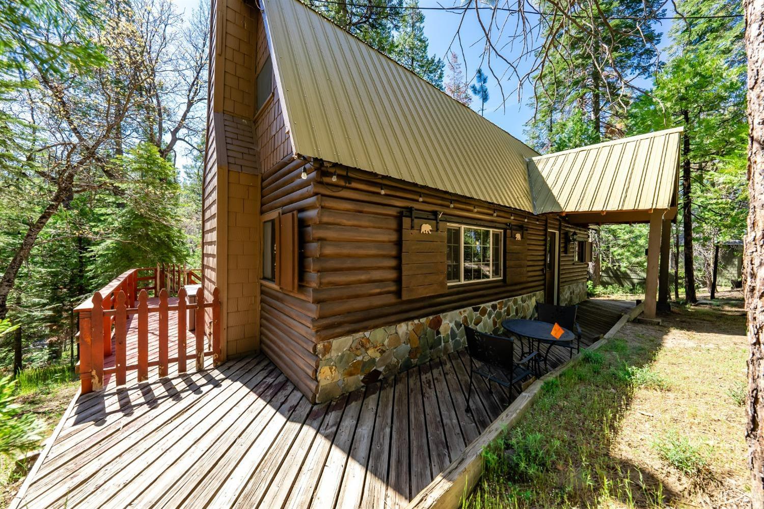 41534 Indian Rock Road Shaver Lake, CA 93664 - Photo 2 of 19 a view of a house with backyard and sitting area