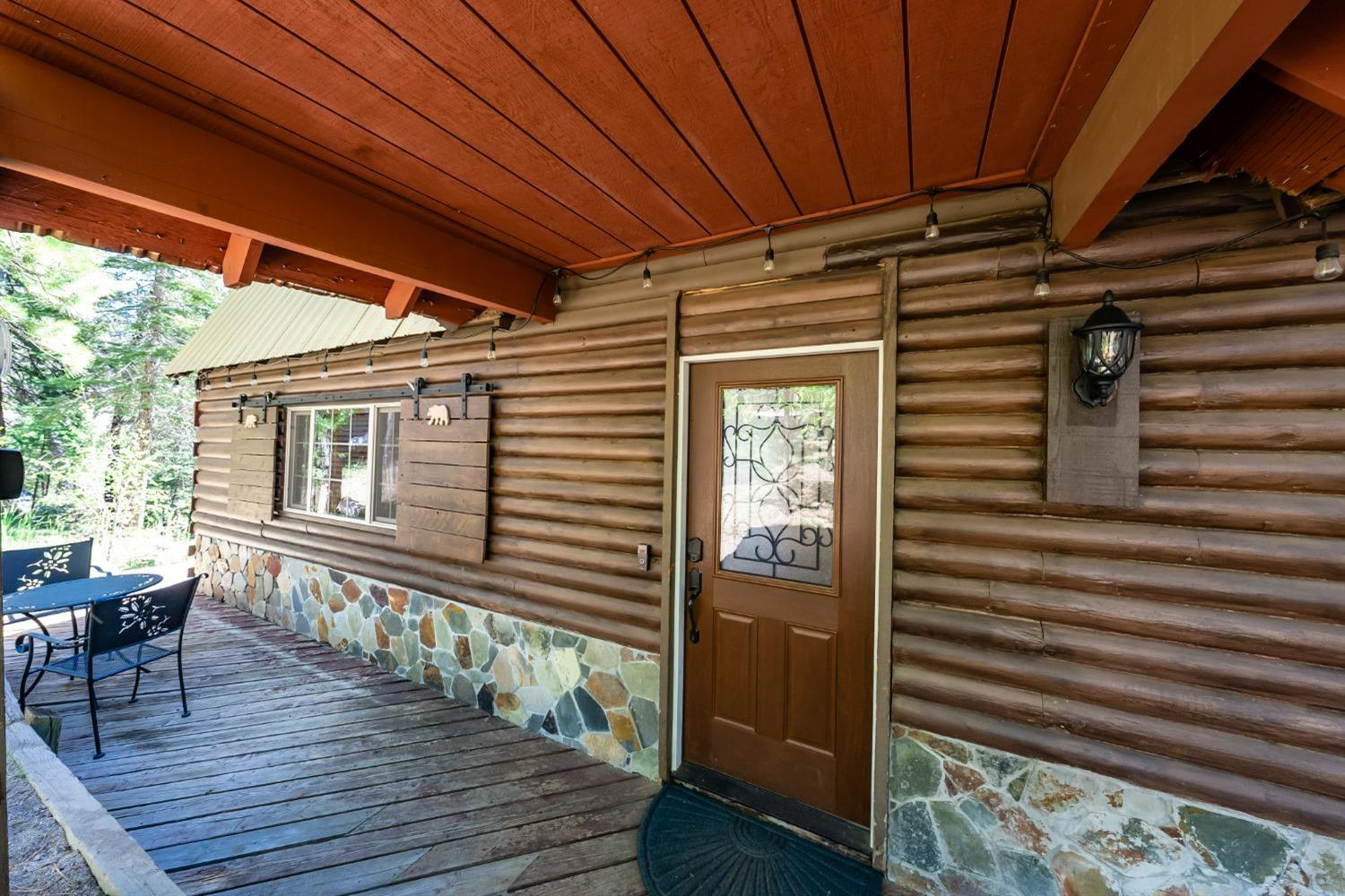 41534 Indian Rock Road Shaver Lake, CA 93664 - Photo 3 of 19 a view of a balcony with furniture