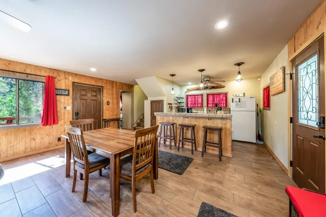 a view of a dining room with furniture window and wooden floor