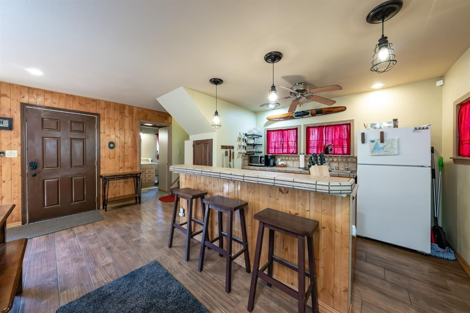 41534 Indian Rock Road Shaver Lake, CA 93664 - Photo 9 of 19 a kitchen with stainless steel appliances granite countertop a refrigerator and a stove top oven